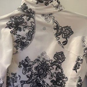 Lululemon zip up track jacket - size 4. Black and white. Floral print.